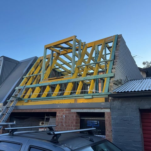 Large timber roof frame under construction