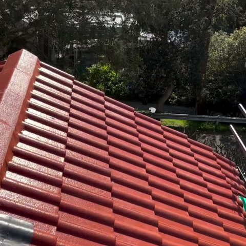 Finished red tiled roof with clean ridge lines