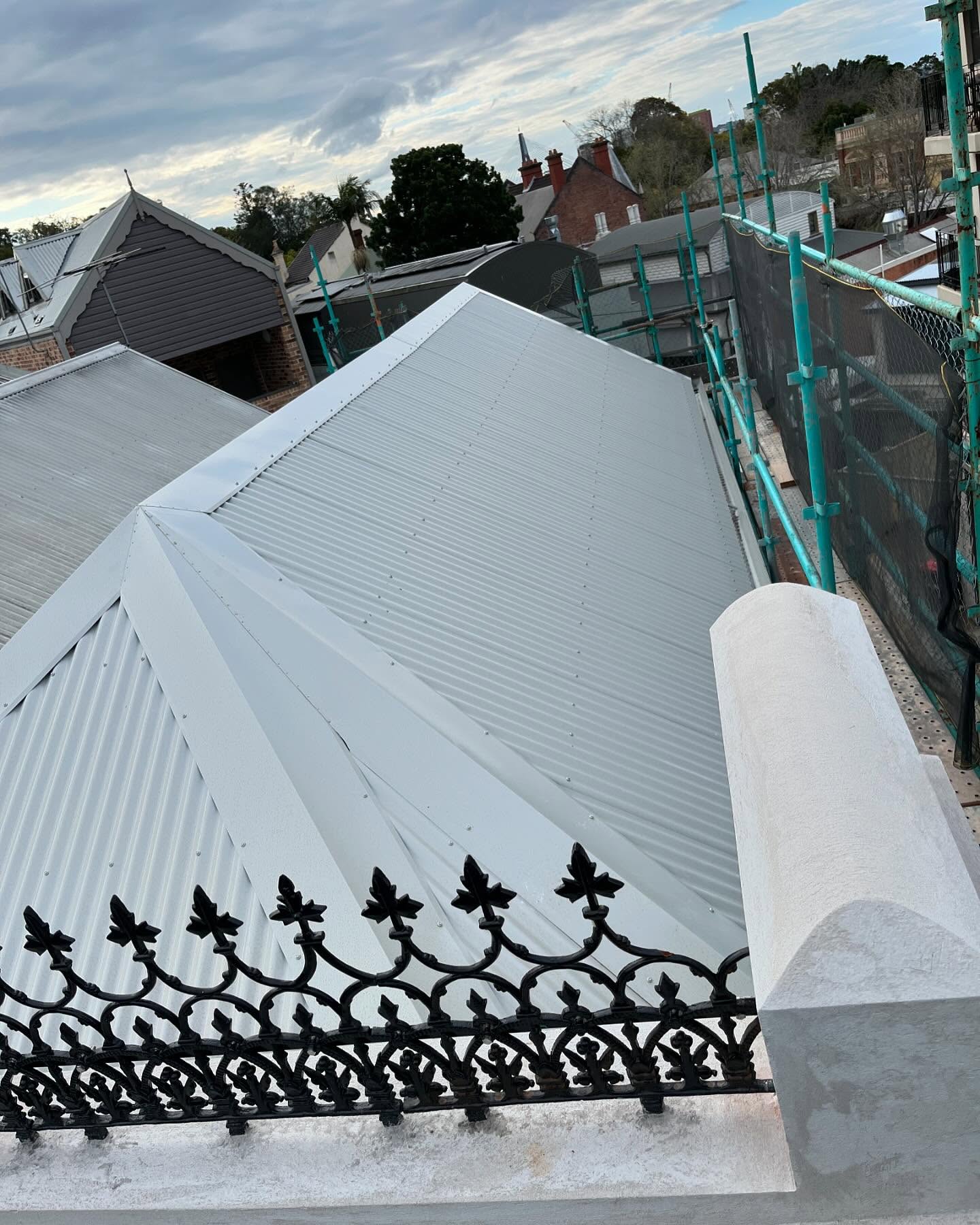 Completed white metal roof after replacement