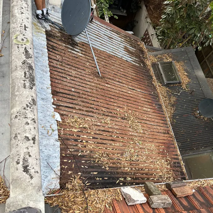 Old rusted roof before Naz Roofing work